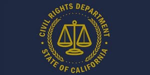 Logo of the Civil Rights Department of the State of California, featuring a pair of scales symbolizing justice, surrounded by laurel leaves. This image relates to California Pay Data Reporting Requirements.