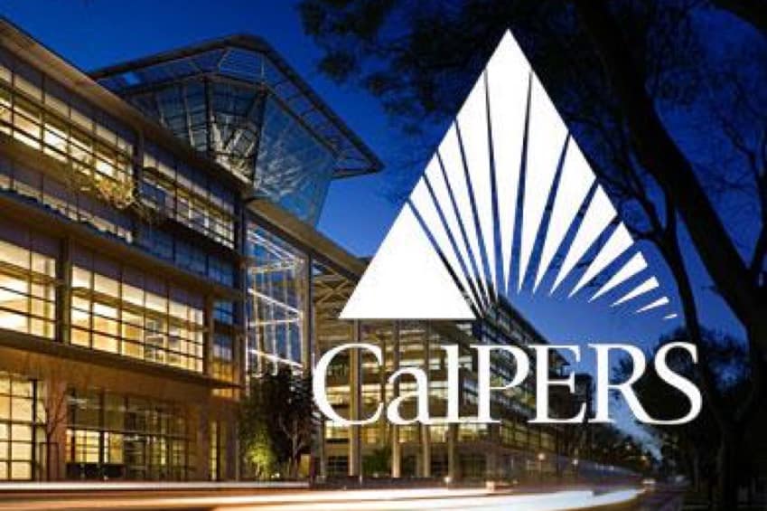 The photo shows a modern building at dusk, with large glass windows and a distinct architectural design. Prominently featured is the CalPERS logo, which includes a stylized triangle and sunburst graphic.
